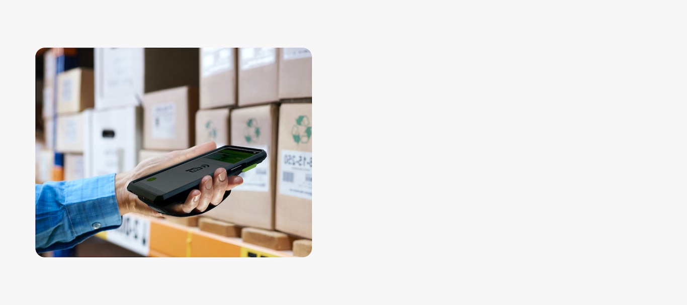 An image of holding a mobile phone and scanning the barcode.
