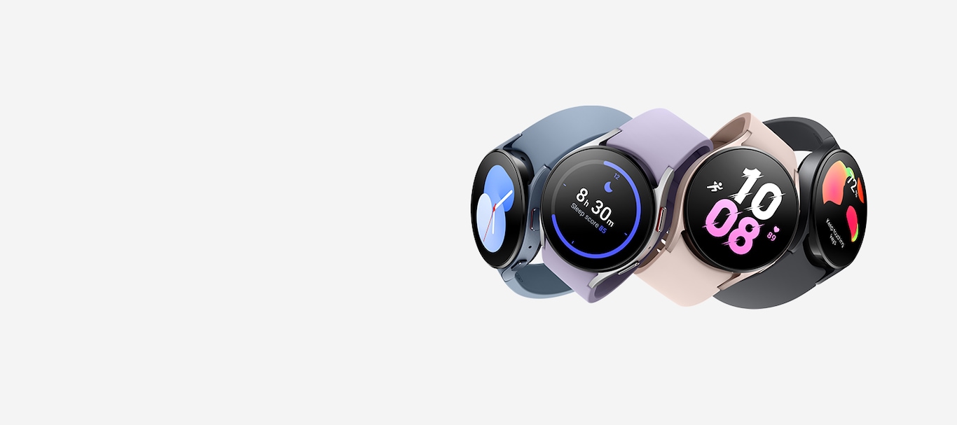 Four Galaxy Watch5 devices are stacked on top of each other in four different colours (Graphite, Pink Gold, Silver, and Sapphire). Each showcasing a different interactive watch face to tell the time. Each watch has a different colour watch band, from Black to Pink to Violet to Navy.