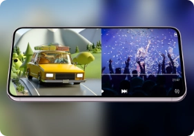 A phone in landscape mode has its screen split between a car game and a concert to show the Galaxy S23 is capable of multitasking, gaming and streaming.