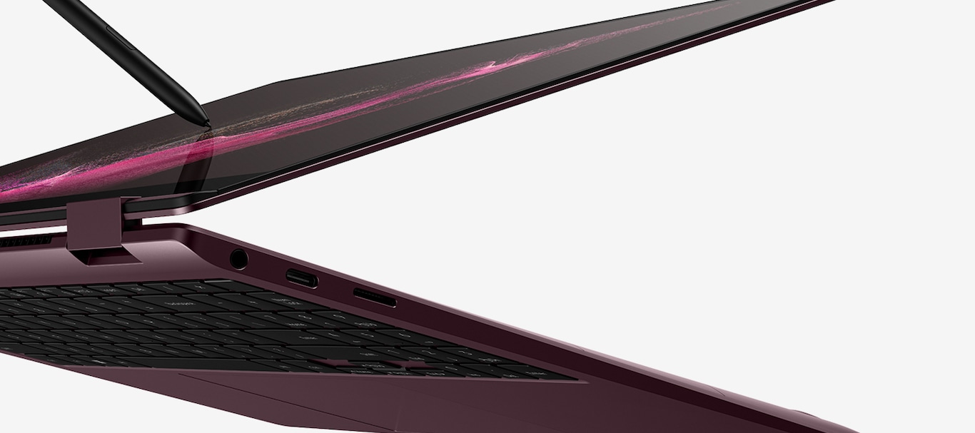 A burgundy-colored Galaxy Book2 Pro 360 is almost folded all the way back and there is a wallpaper with pink waves on the screen. An S Pen is touching the screen.