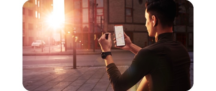 A man using large Samsung Galaxy S22 Ultra smartphone with an S Pen