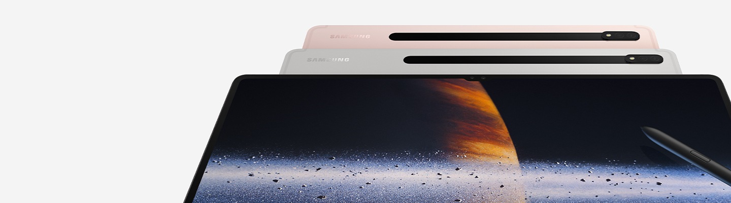 Three Galaxy Tab S8 Series are shown from the front, tilted to the back. The back two have their rear sides facing forward and are overlayed by the front one, which has its display showing a close up of Saturn and its rings. A S Pen is also leaning onto the display at an angle.