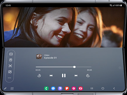 A video plays on the Main Screen of Galaxy Z Fold5 in Flex Mode. The Flex Mode Panel shows playback controls on the bottom half of the screen.