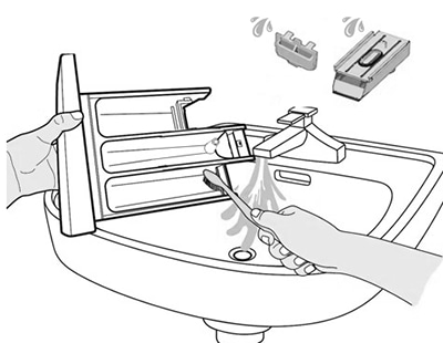 Rinse detergent drawer compartments in running water