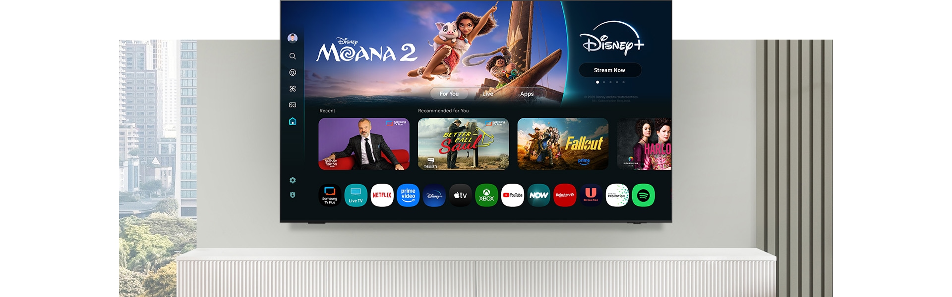 A TV displays a One UI Tizen screen with options to stream free TV and various apps and services like Samsung TV Plus.