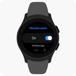 A Galaxy Watch is on a surface while its face shows a menu for turning on vibrations.