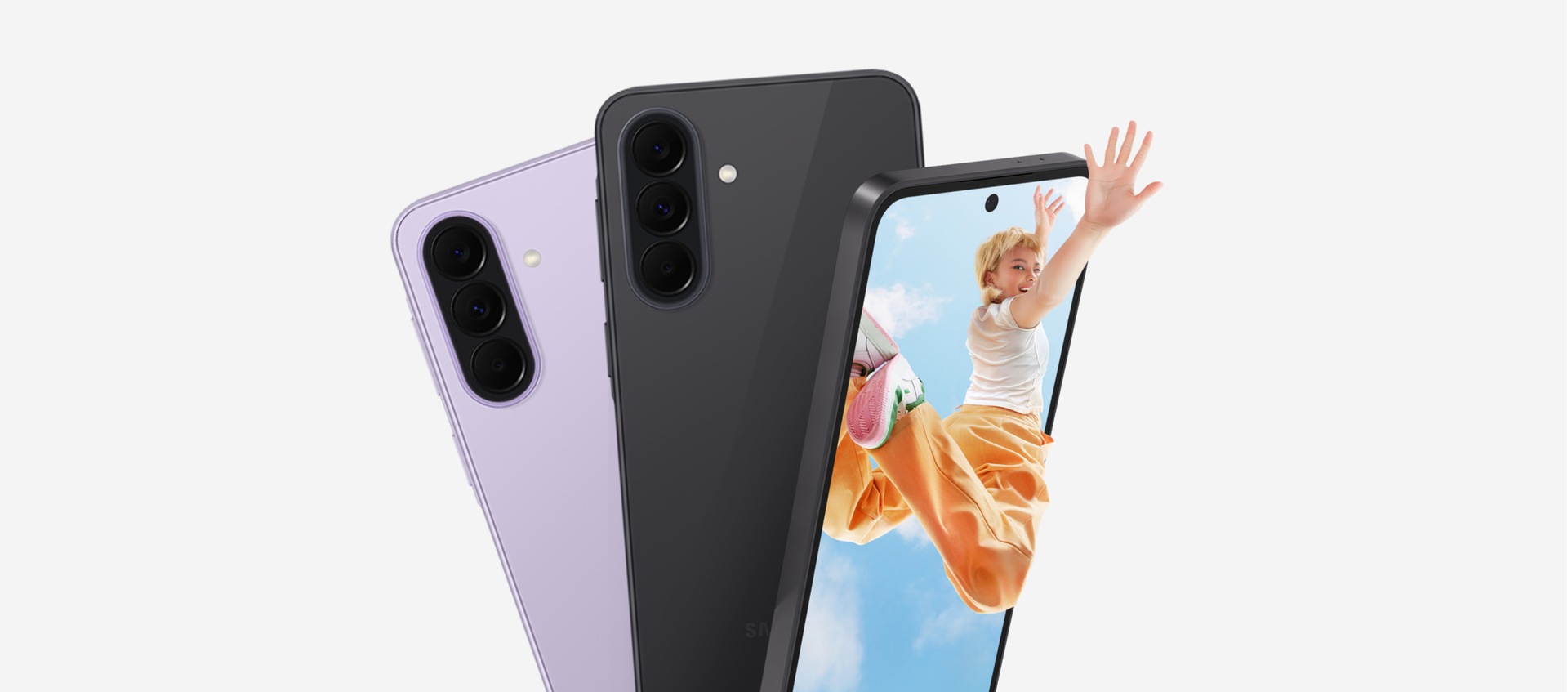 Galaxy A37 5G in Awesome Lavender, Awesome Graygreen and Awesome White are shown from the side and back view, highlighting the slim design and the Triple Camera system on the back. Galaxy A37 5G in Awesome Charcoal is facing slightly right with a colorful image onscreen of a young woman jumping in the air with her hand reaching outside of the phone screen. Awesome. The new Galaxy A37 5G.