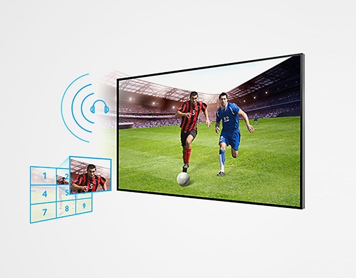 Tela da TV Samsung HD Flat 32"vertical em perspectiva lateral direita com jogadores de futebol no gramado. Ao lado esquerdo,ilustração do ícone do efeito de som multi-surround e abaixo dele outra ilustração do ícone de ampliação de área selecionada da tela para melhor visualização. 
