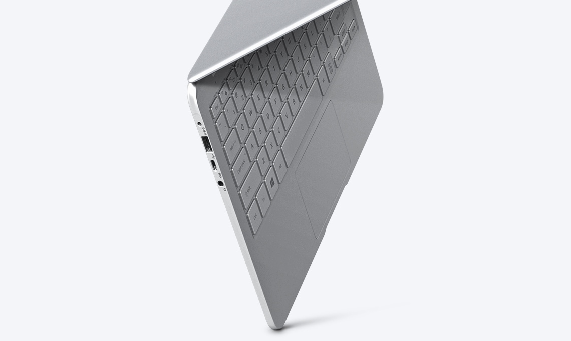 An image showing a silver Notebook 9 device’s side, with its keyboard showing, suspended in mid-air, against a white backdrop.