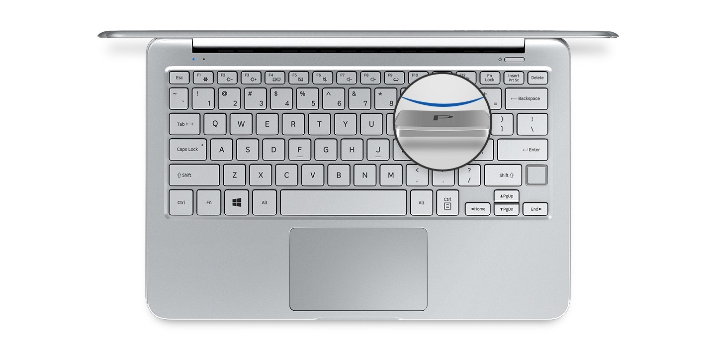 An image showing a top view of a silver Notebook 9 device’s cover open,with  its keyboard and a magnified image of one of its keycaps.