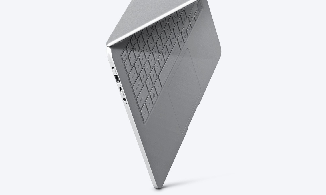 An image showing a silver Notebook 9 device’s side, with its keyboard showing, suspended in mid-air, against a white backdrop.