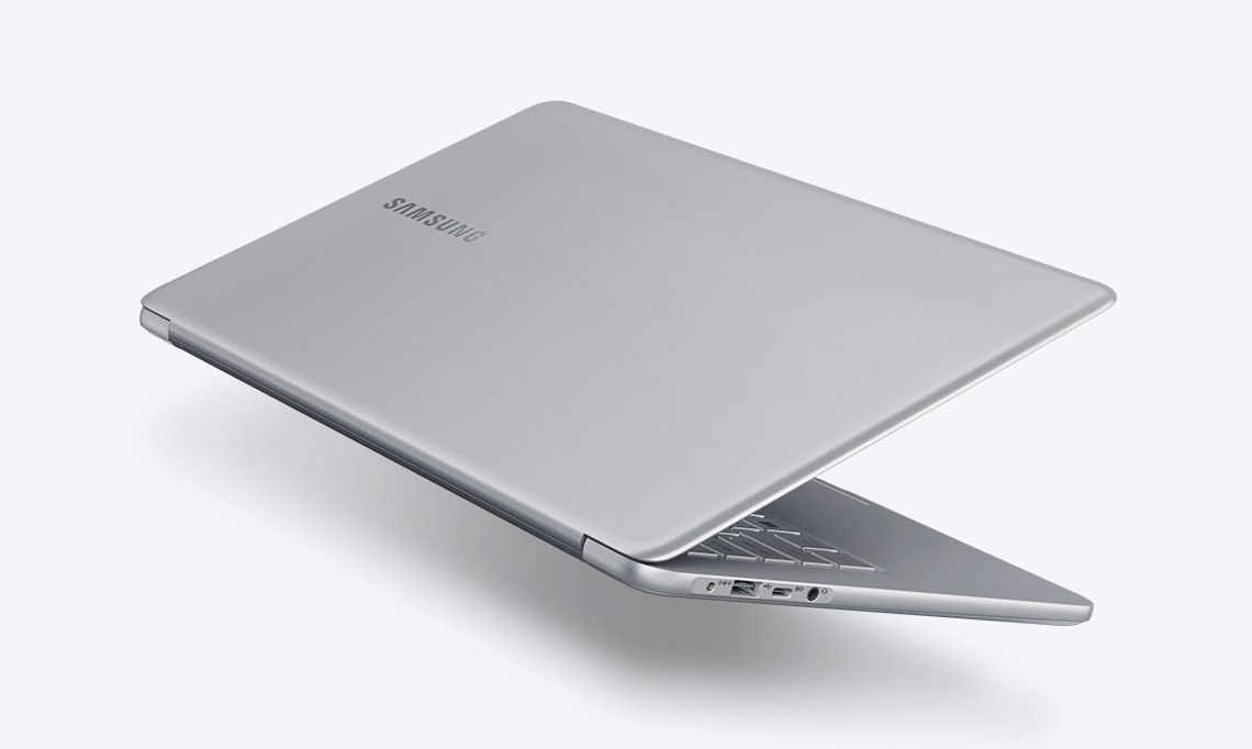 A image of the left side of the Notebook 9 device’s bottom part, with its cover showing, partially open, with the Samsung logo visible.