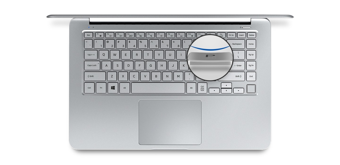 An image showing a top view of a silver Notebook 9 device’s cover open,with  its keyboard and a magnified image of one of its keycaps.