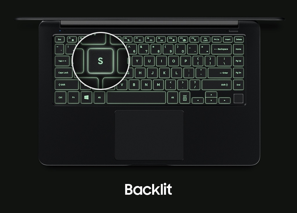 An image showing a top view of the Notebook 9’s cover open, with a backlit keyboard and a magnified image of its “S” key.