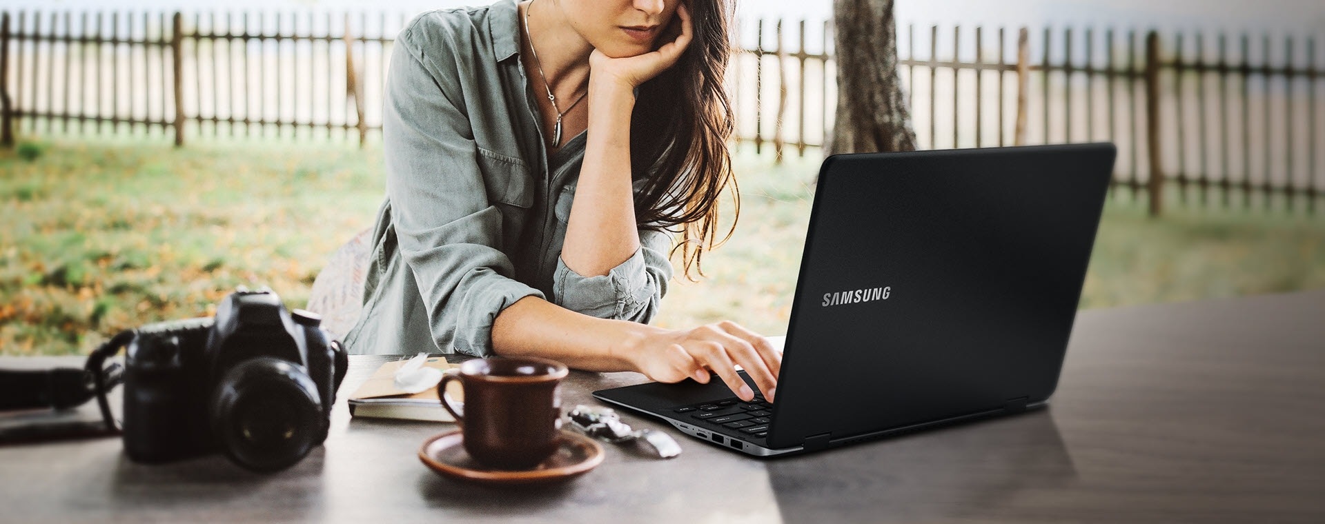 An image showing a woman using a Notebook 9 spin outdoors.