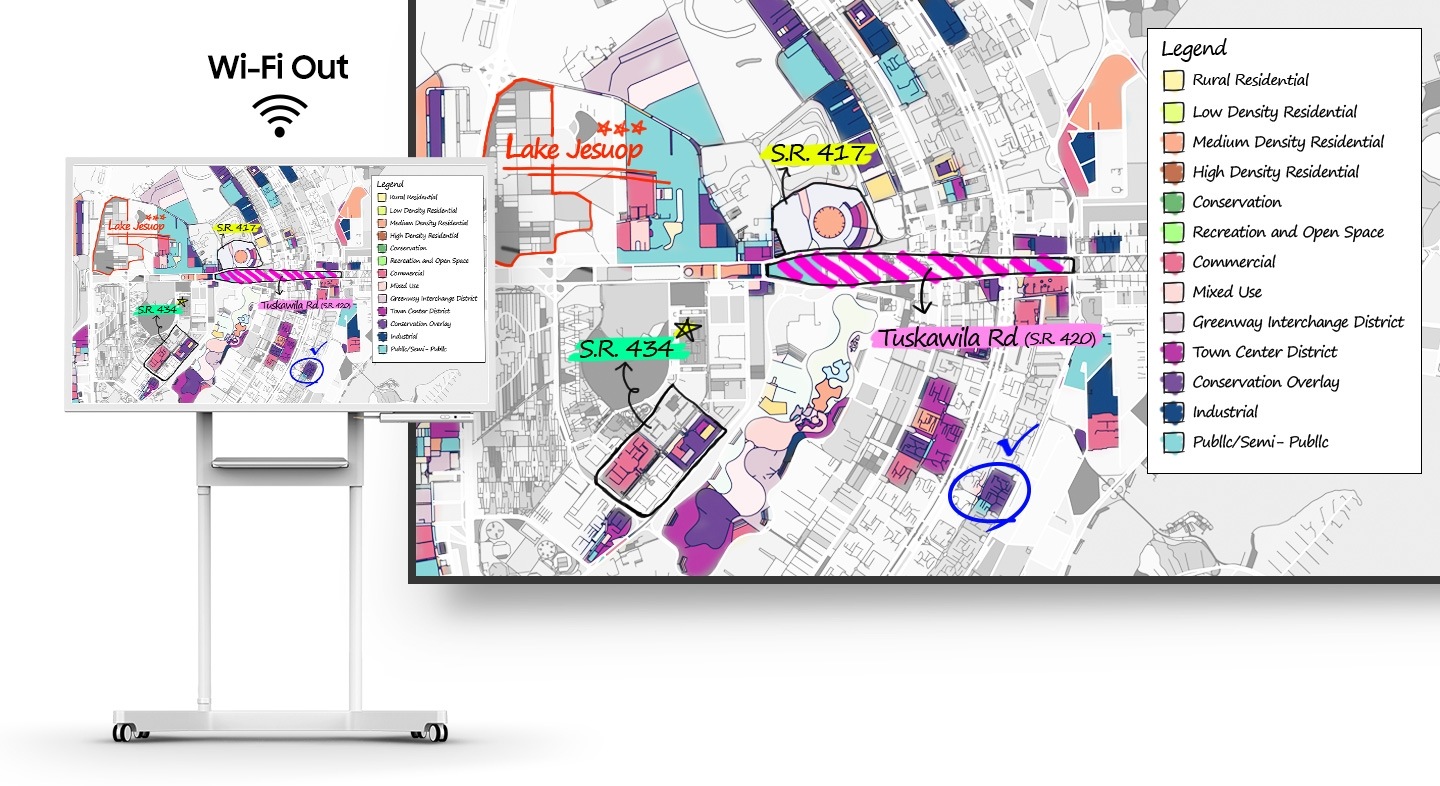 A Samsung Flip display unit shows a map with a legend. Behind it is text that reads 'Wi-Fi Out,' and the screen map and legend can also be seen on a large monitor to the right.