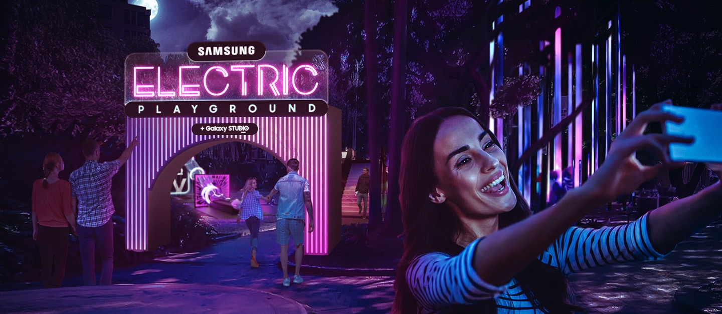 Woman taking selfie in front of Electric Playground entrance