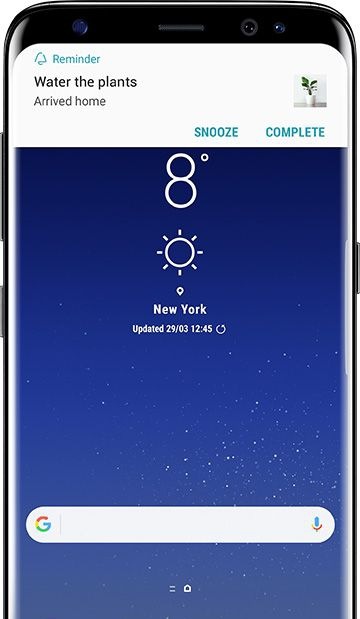 Reminder to Water the plants when user arrives home is up on the Galaxy S8 screen