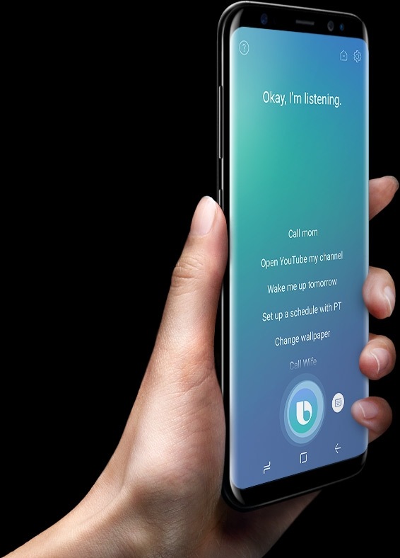 Image of hand holding Galaxy S8 in three-quarter view, showing Bixbys dedicated button on the left