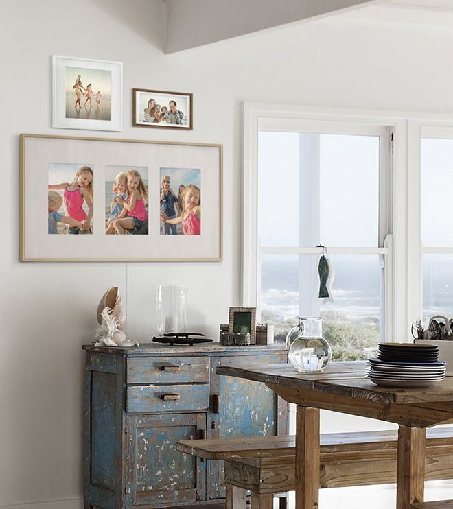 The Frame displaying three photographs in Triptych layout with antique matte color, hanging on the wall in dining room.