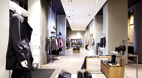 Samsung LEDs a narrow and long fashion store where displays are shone by spot lights