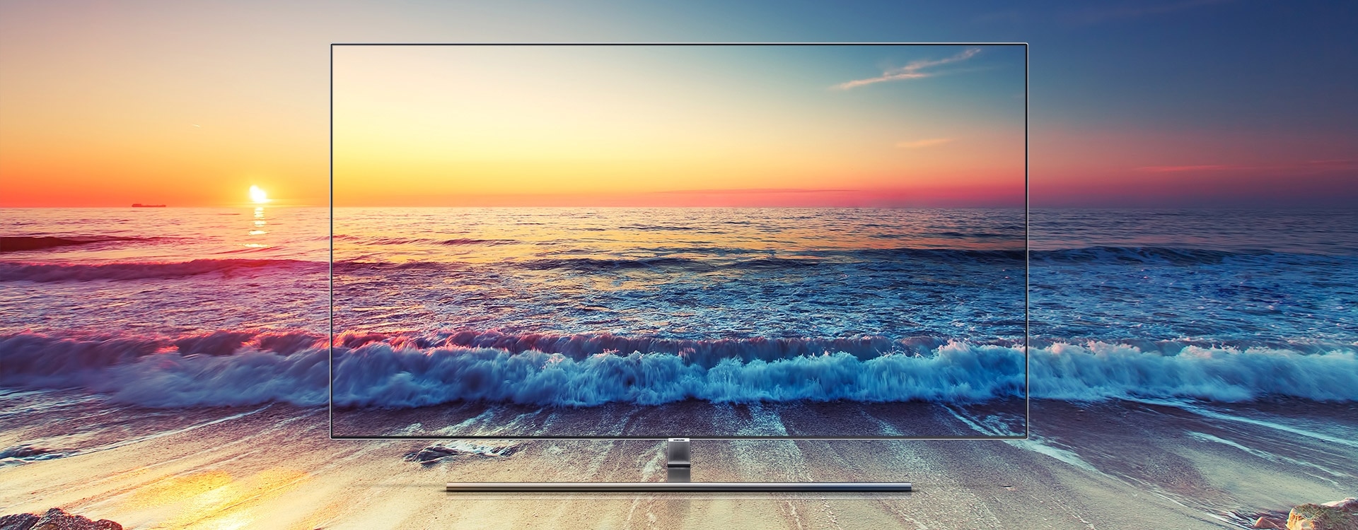 A scenery of a sunset beach is shown in rich colors along with Samsung QLED TV