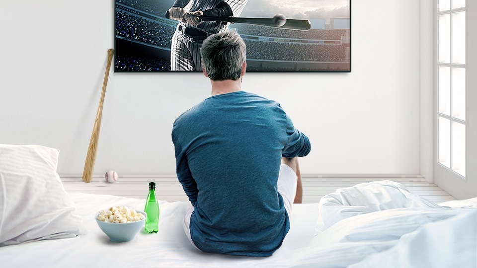 A man watching sports via the smart hub