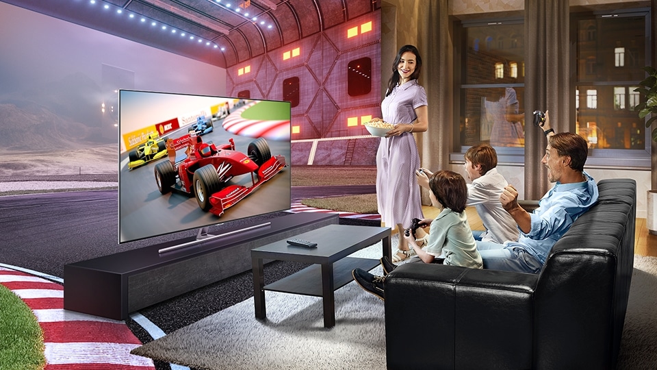 A family playing car racing game with Samsung’s QLED TV