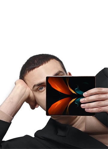 A man holding the Galaxy Z Fold2