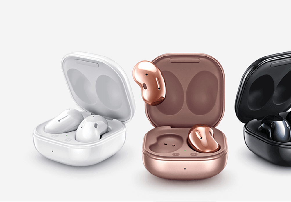 Three Galaxy Buds Live devices with their cases in Mystic White, Mystic Bronze, and Mystic Black, with one of the Mystic Bronze Buds outside of the case