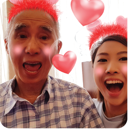 An image of an old man and a young woman having fun with AR Stickers on a Samsung J7 Plus Photobooth feature. Discover more Samsung J7+ specs here