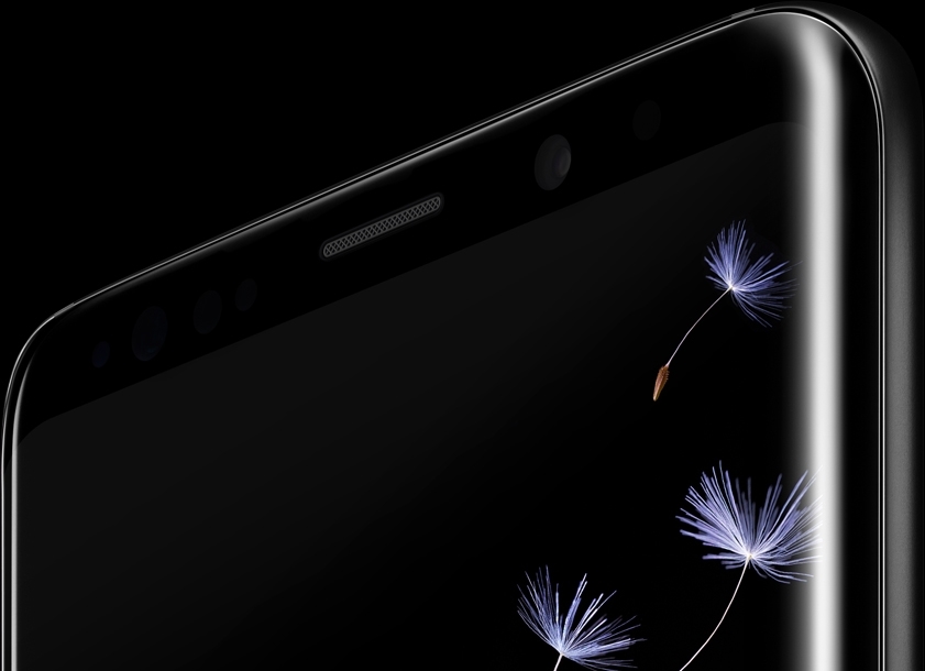 Galaxy S9 미드나잇 블랙 제품이 강조되어 보여지며, 화면에는 민들레가 날리고 있습니다.