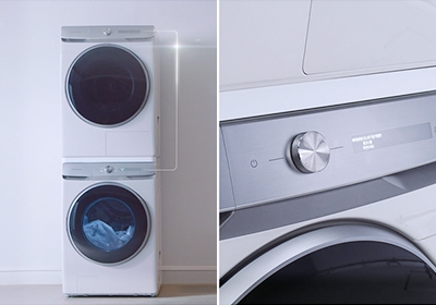 직렬연결된 건조기와 세탁기가 있고 세탁기의 조작 패널과 건조기의 조작 패널이 이어져 있다는 것을 설명하는 하얀 선이 보이며 아래층에 있는 세탁기의 조작 패널을 클로즈업한 모습입니다.