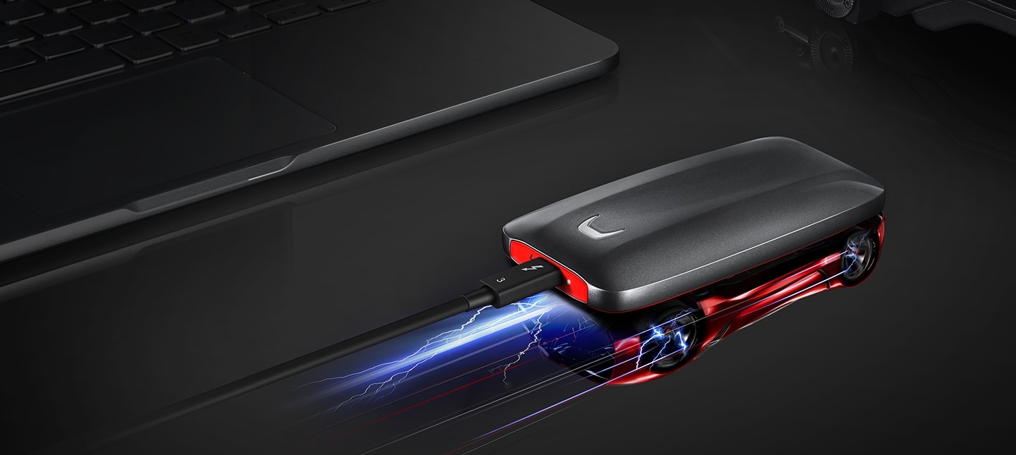 Samsung Portable SSD X5 connected to the Thunderboltâ„¢ 3 ports and the racing car is reflected on the surface.