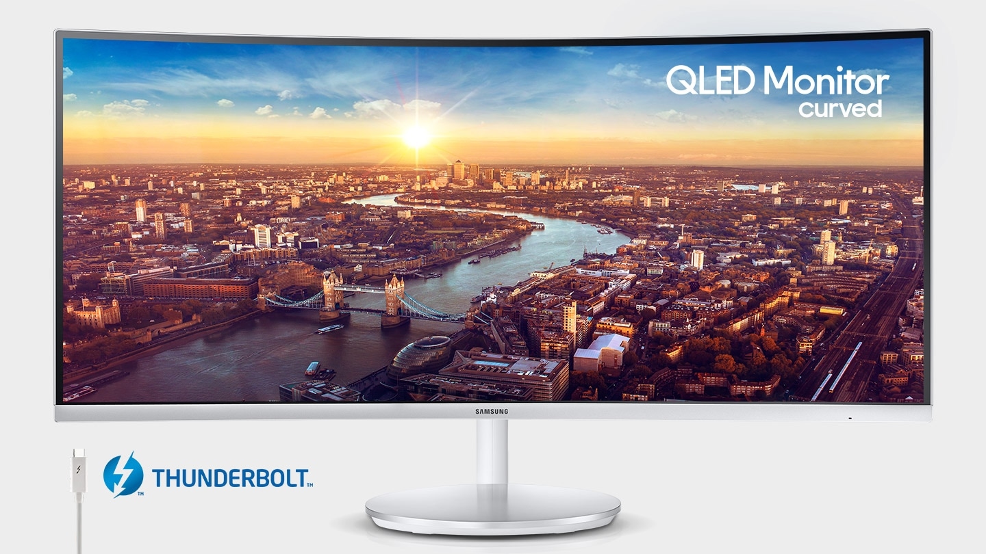 The QLED curved monitor depicts the city seen from a distance, along with one of its features, Thunderbolt.