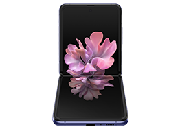 Galaxy Z Flip in Mirror Purple folded to a right angle, seen from the front with the blossoming flower graphic wallpaper on screen