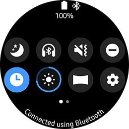 Watch face with activated watch icon and expressed brightness as a circular progress bar.