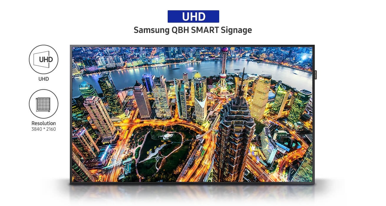 An image showing the QBH Series display product showcasing a night-time cityscape. Also, text that reads UHD Samsung QBH SMART Signage is visible with UHD and 3,840x2,160 resolution icons.