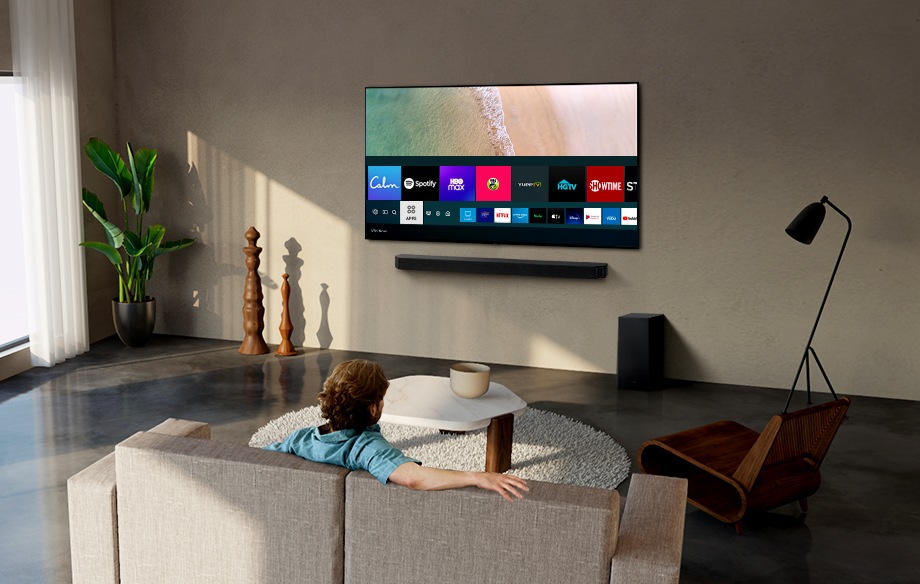 A man connects to Spotify on his Samsung Smart tv and streams music on his soundbar.