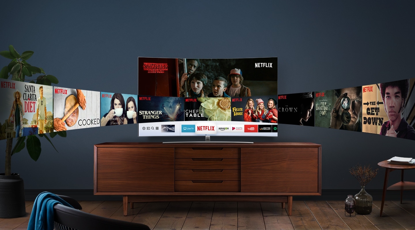 Curved screen QLED TV is placed on the wooden shelf, and various NETFLIX contents on the screen are displayed like a panorama on the screen.