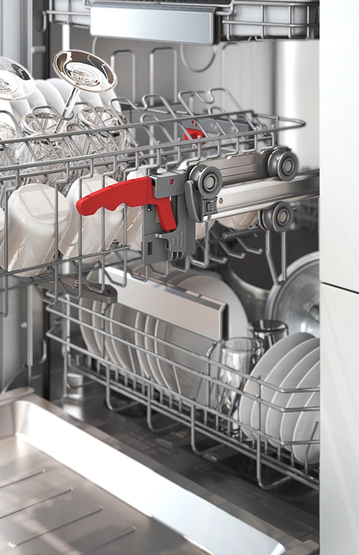 Shows a rack full of dishes, which can be pulled out easily using the dishwasher's Soft Railing system.