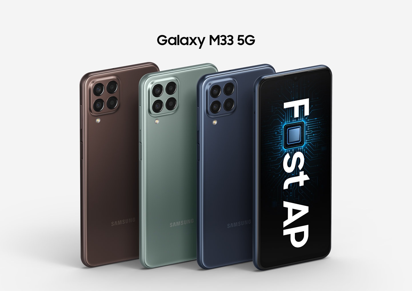 Four Galaxy M33 5G devices are shown with three of them showing the backside to display the Brown, Green and Blue colorways. The only front-facing device, located on the right edge, shows text that reads Fast AP with the a in Fast replaced with a processing chip.