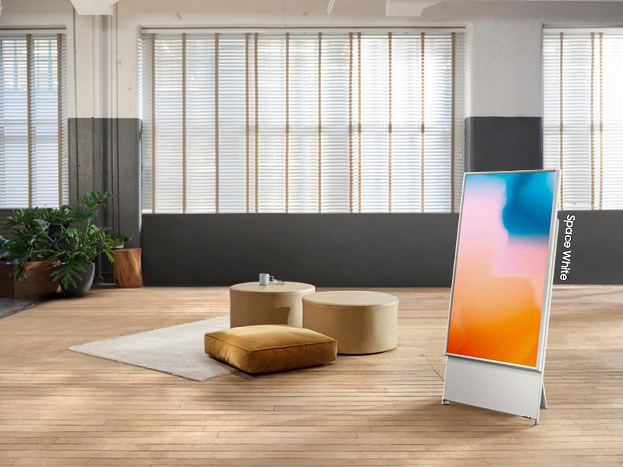 The Sero in space white is in vertical mode on display in a living room.