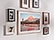 The Frame is hanging on a wall via a Slim Fit Wall Mount to look like a real picture frame. 