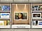 The Frame showing the Mona Lisa is displayed on a stand in the center. To its left and right, various art options found in the Art Store are displayed.