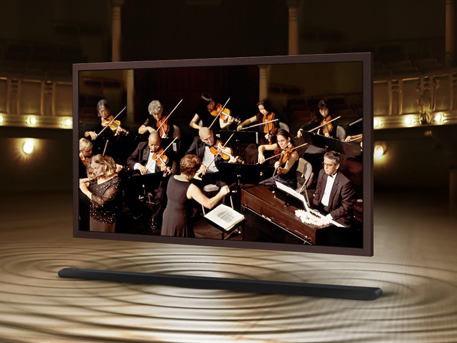 The Frame is showing an orchestra on its screen. The Soundbar is below The Frame with sound ripples coming out of it to show that the sound of the speakers on The Frame and Soundbar are perfectly synced. 