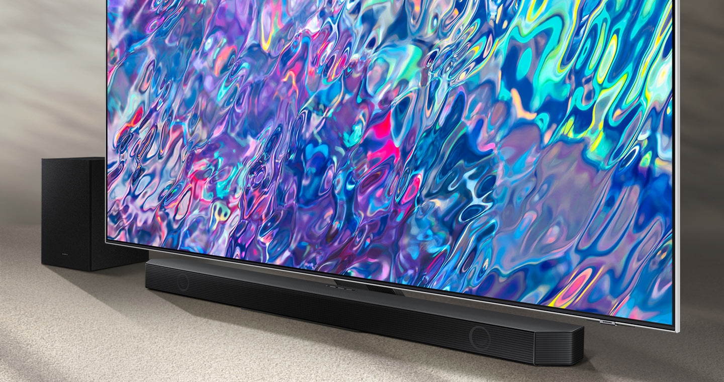 Samsung Q series Soundbar and subwoofer are positioned with QLED TV.