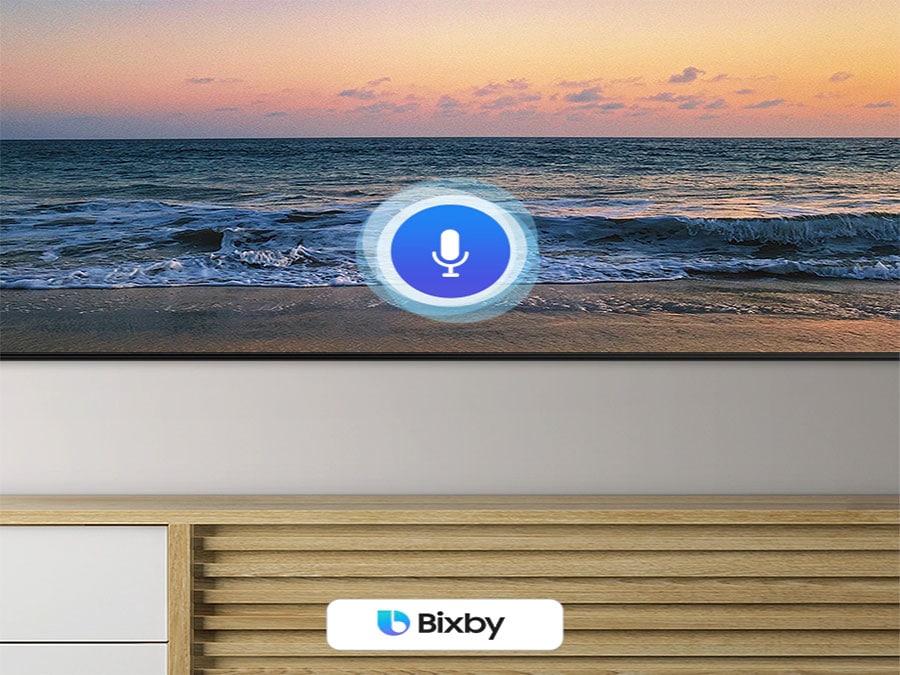 A microphone icon overlays an image, demonstrating voice assistant feature. The Bixby, Alexa built-in and the OK Google logos are on display on the bottom.