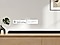 Apple AirPlay logo, Chromecast Built-in logo, and Ok Google logo can be seen along with Samsung S800B soundbar which is sitting on living room cabinet.