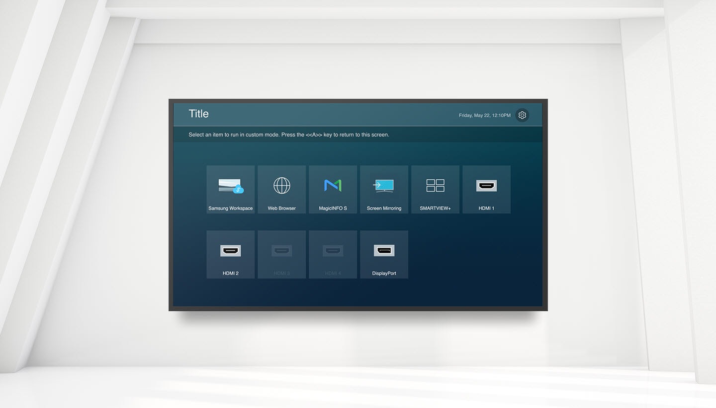 There is a custom home function screen in the QBB. Title is written on the upper left, the day and time are written on the upper right, and there is a setting icon next to it. Select an item to run in custom mode. Samsung Workspace, Web Browser, MagicINFO S, Screen Mirroring, SMARTVIEW+, HDMI 1, HDMI 2, DisplayPort features are listed with the text Press the <<A>> key to return to this screen.